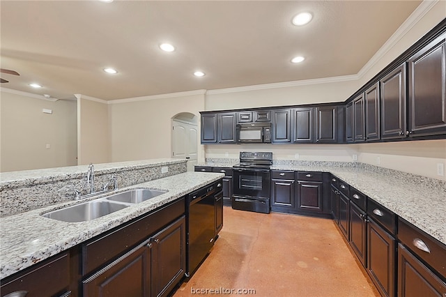 kitchen with a sink, black appliances, finished concrete floors, ornamental molding, and arched walkways