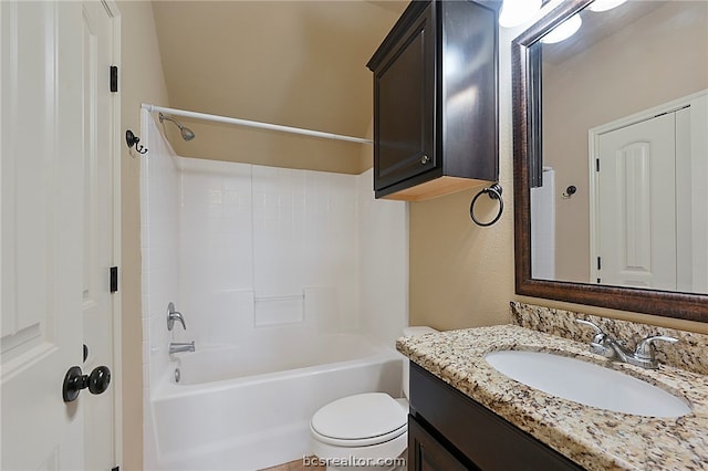 bathroom featuring toilet, vanity, and shower / bathtub combination
