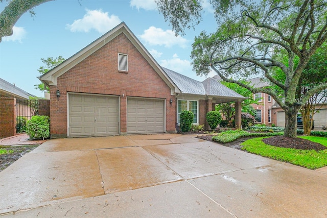 13727 Aspen Cove Dr, Houston, TX 77077 - view of front of home featuring brick siding, a garage, fence, and concrete driveway