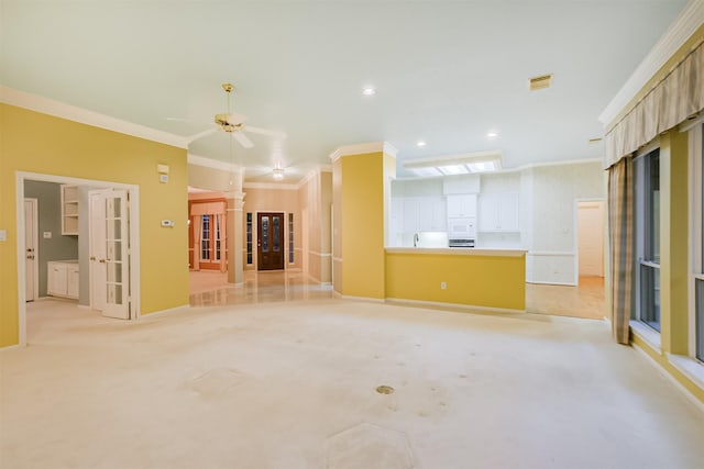 13727 Aspen Cove Dr, Houston, TX 77077 - unfurnished living room featuring french doors, ornamental molding, light colored carpet, baseboards, and recessed lighting
