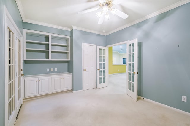 13727 Aspen Cove Dr, Houston, TX 77077 - unfurnished room featuring french doors, crown molding, a ceiling fan, baseboards, and light colored carpet
