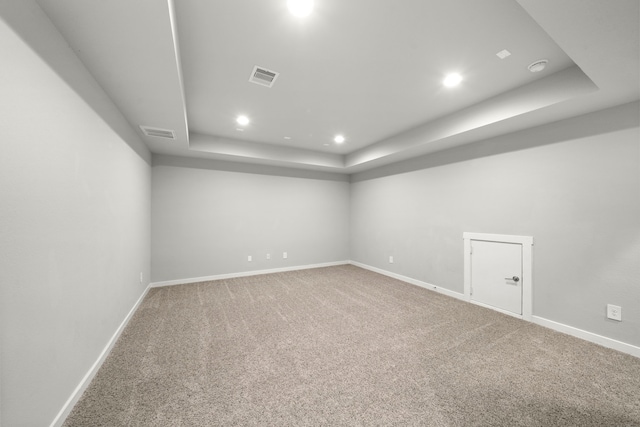 finished below grade area with carpet, visible vents, recessed lighting, and baseboards