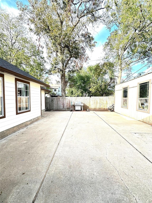 view of patio featuring fence