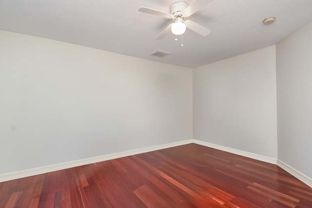 unfurnished room featuring visible vents, ceiling fan, wood finished floors, and baseboards