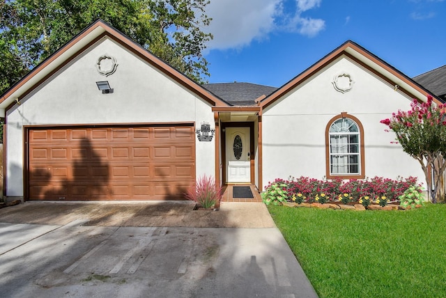 single story home with a front lawn, stucco siding, driveway, and roof with shingles