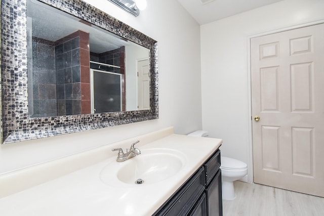 1802 Terry St, Houston, TX 77009 - full bathroom with vanity, a tile shower, and wood finished floors