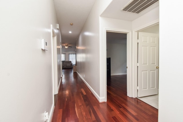 hall featuring recessed lighting, visible vents, wood finished floors, and baseboards
