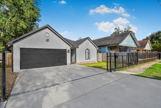 1802 Terry St, Houston, TX 77009 - single story home with stucco siding, concrete driveway, and an attached garage