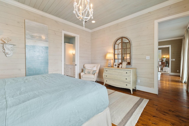 bedroom featuring wooden walls, crown molding, a notable chandelier, and hardwood / wood-style flooring