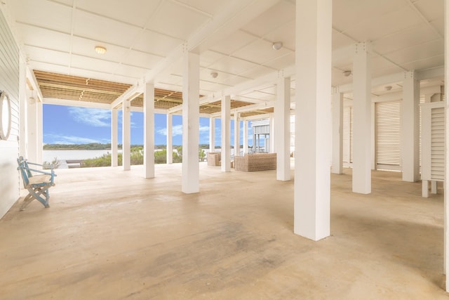 view of patio featuring an outdoor living space and a water view