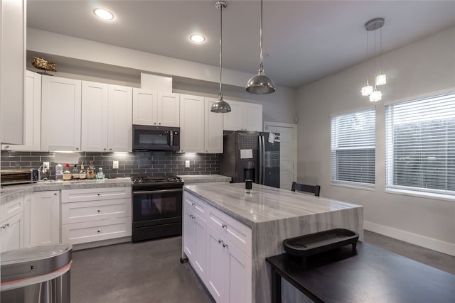 kitchen with black appliances, concrete floors, and decorative backsplash
