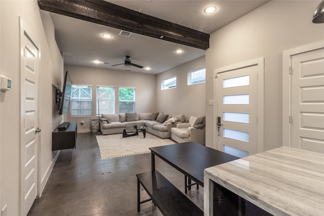 living area with beamed ceiling, recessed lighting, ceiling fan, concrete floors, and visible vents