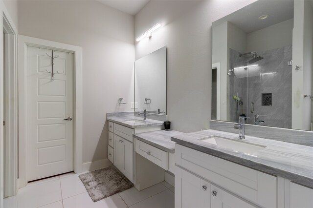 bathroom with vanity, a shower stall, and tile patterned floors