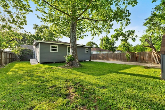 view of yard with a fenced backyard