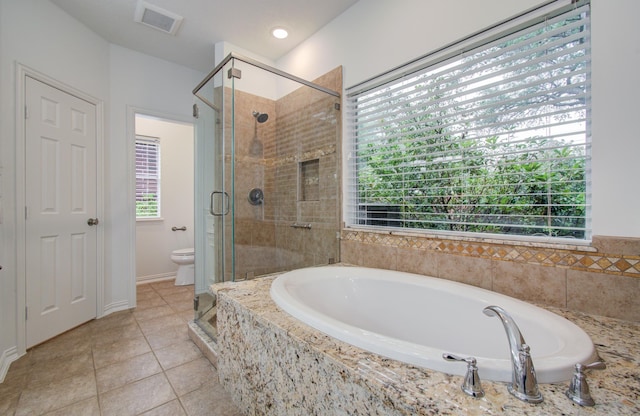 7203 W Hearthstone Green Dr, Houston, TX 77095 - bathroom featuring a bath, healthy amount of natural light, toilet, and a shower stall