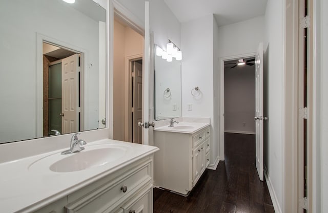 7203 W Hearthstone Green Dr, Houston, TX 77095 - bathroom with two vanities and wood finished floors