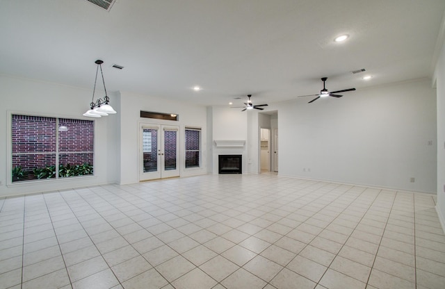 7203 W Hearthstone Green Dr, Houston, TX 77095 - unfurnished living room with a glass covered fireplace, recessed lighting, light tile patterned floors, ceiling fan, and french doors