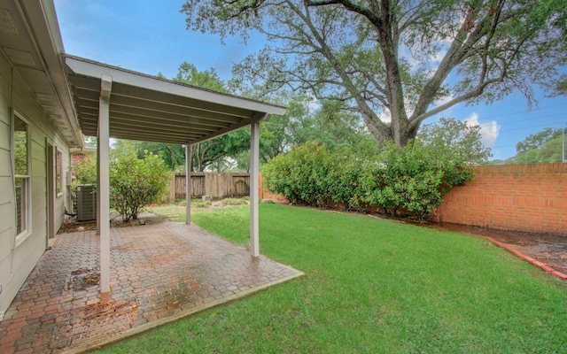 7203 W Hearthstone Green Dr, Houston, TX 77095 - view of yard featuring central AC and a patio