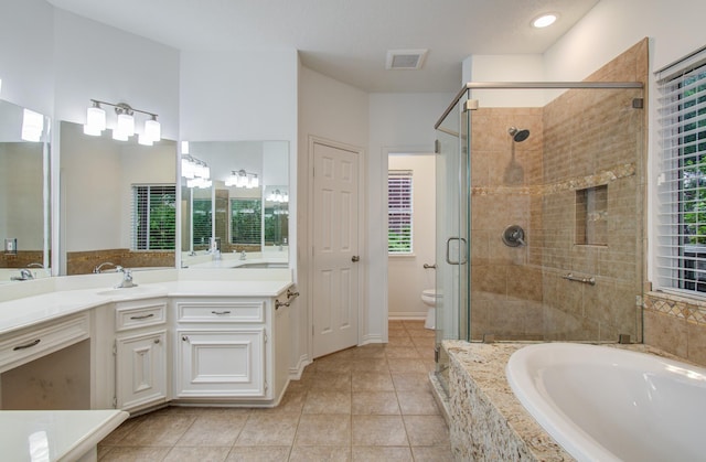 7203 W Hearthstone Green Dr, Houston, TX 77095 - bathroom with a garden tub, a shower stall, vanity, toilet, and tile patterned floors
