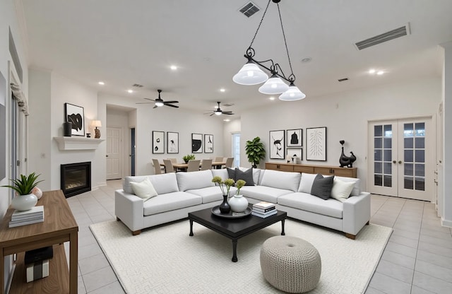 7203 W Hearthstone Green Dr, Houston, TX 77095 - living room with light tile patterned flooring, a glass covered fireplace, french doors, a ceiling fan, and recessed lighting