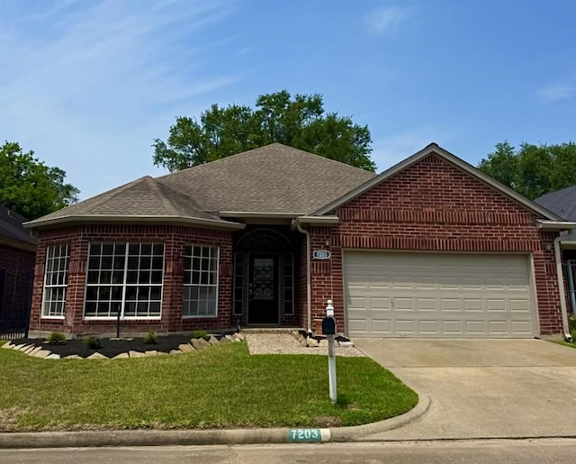 7203 W Hearthstone Green Dr, Houston, TX 77095 - ranch-style home featuring brick siding, an attached garage, driveway, and a front lawn