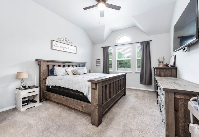 bedroom featuring baseboards, a ceiling fan, light colored carpet, and vaulted ceiling