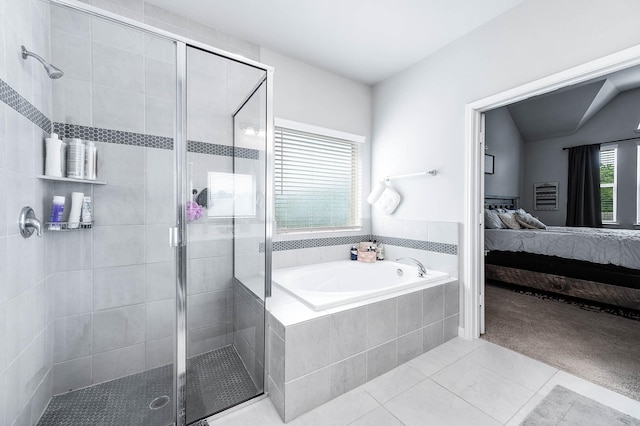 ensuite bathroom featuring a garden tub, connected bathroom, a shower stall, and tile patterned flooring