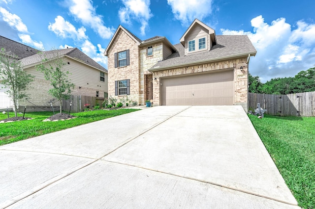 traditional home featuring brick siding, fence, a shingled roof, driveway, and a front lawn