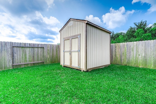 view of shed featuring a fenced backyard