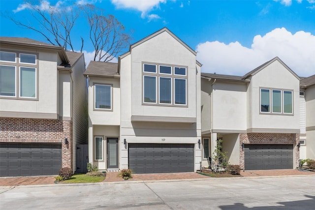 107 Knightsbridge Park Ln, Houston, TX 77018 - multi unit property with an attached garage, decorative driveway, and stucco siding