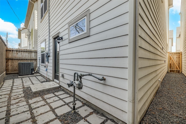 107 Knightsbridge Park Ln, Houston, TX 77018 - view of side of property featuring fence, central AC, and a patio