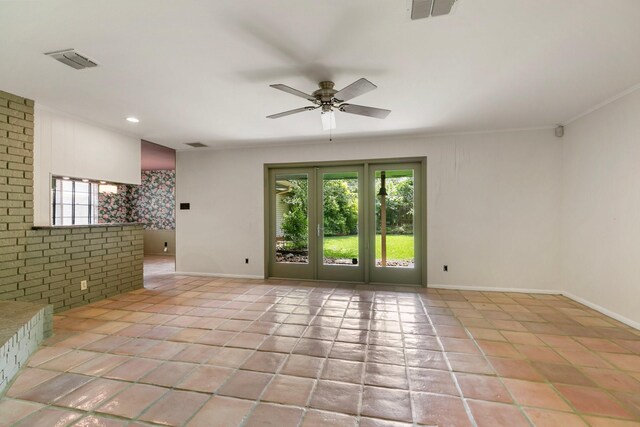 empty room with plenty of natural light, ceiling fan, and visible vents
