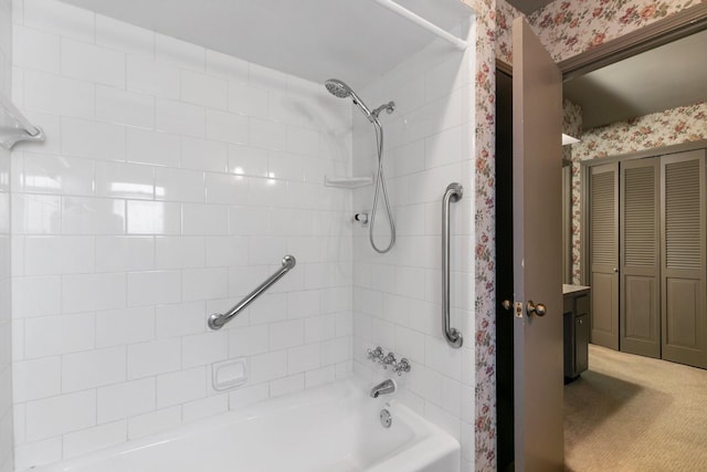 full bath with shower / bathtub combination, wallpapered walls, and a closet