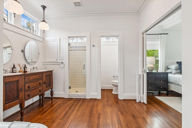 1202 Ashland St, Houston, TX 77008 - full bath featuring wood finished floors, a stall shower, toilet, crown molding, and baseboards