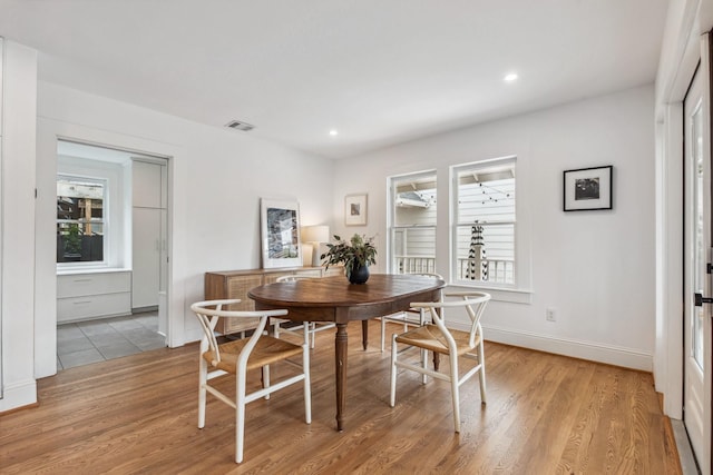1202 Ashland St, Houston, TX 77008 - dining space with healthy amount of natural light, light wood-style flooring, recessed lighting, and baseboards