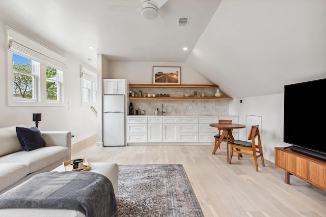 1202 Ashland St, Houston, TX 77008 - living room with light wood-style floors, lofted ceiling, ceiling fan, and recessed lighting