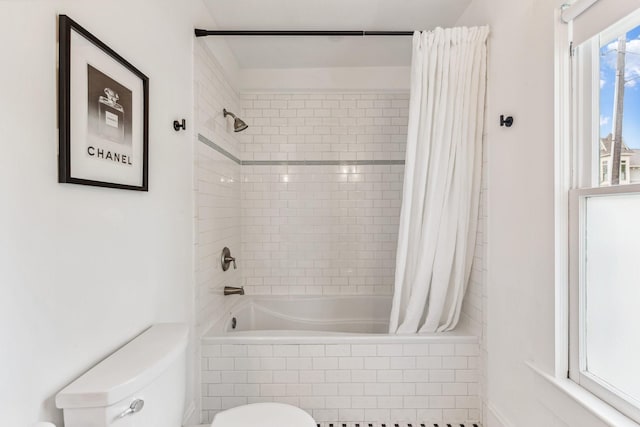 1202 Ashland St, Houston, TX 77008 - bathroom featuring toilet and tiled shower / bath combo