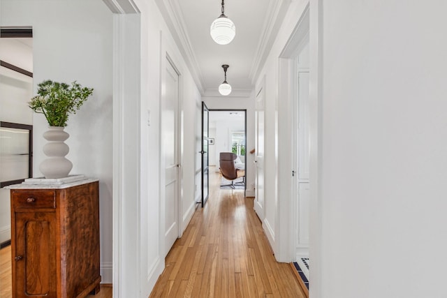1202 Ashland St, Houston, TX 77008 - corridor featuring light wood-style floors, ornamental molding, and baseboards