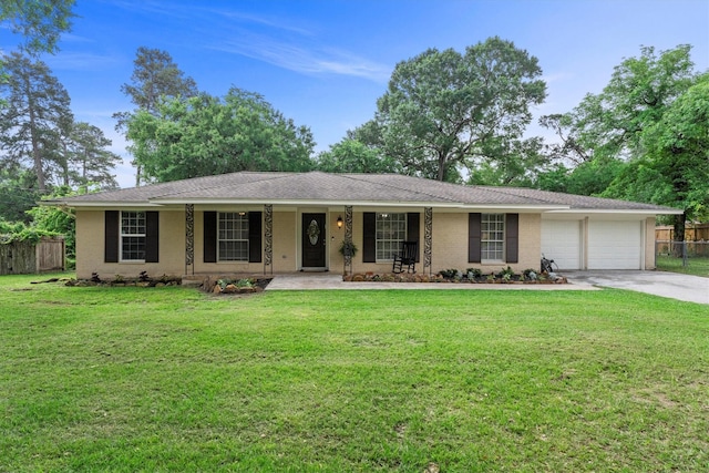 ranch-style house featuring a front lawn, a garage, covered porch, driveway, and fence