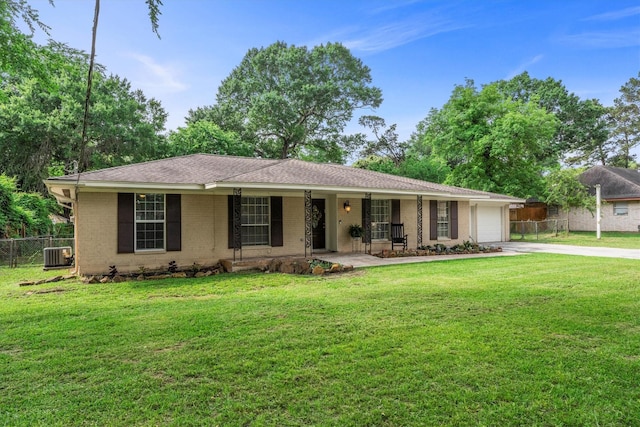 ranch-style home featuring brick siding, fence, cooling unit, and driveway
