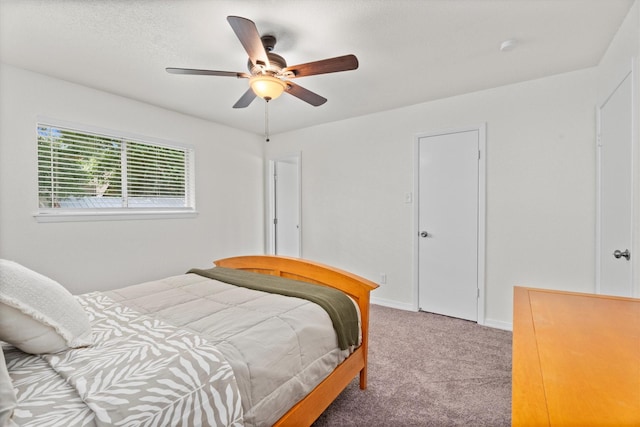 bedroom featuring a ceiling fan, carpet flooring, and baseboards