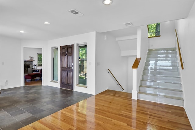 20998 Kiva Cir, Flint, TX 75762 - foyer with wood finished floors, visible vents, recessed lighting, and a fireplace