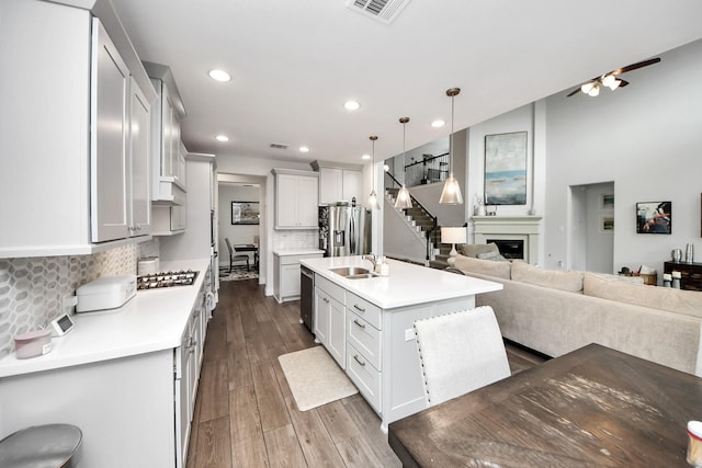 2242 Bayleaf Manor Dr, Manvel, TX 77578 - kitchen featuring a sink, light countertops, stainless steel appliances, open floor plan, and visible vents