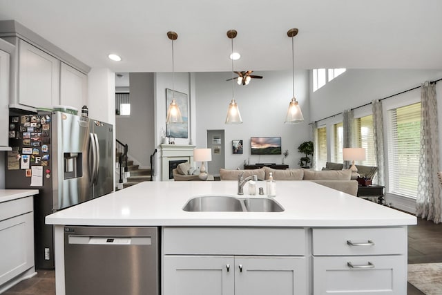 2242 Bayleaf Manor Dr, Manvel, TX 77578 - kitchen featuring a sink, light countertops, stainless steel appliances, and open floor plan