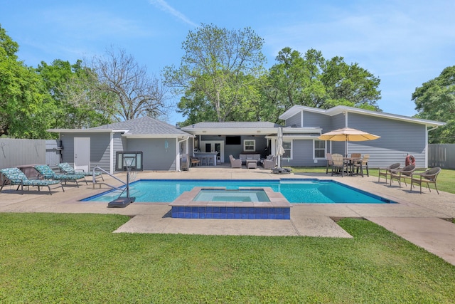 1315 Kilgore Rd, Baytown, TX 77520 - view of pool with a lawn, a patio, a pool with connected hot tub, and fence