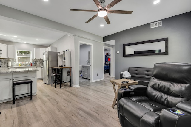 1315 Kilgore Rd, Baytown, TX 77520 - living room featuring a ceiling fan, visible vents, light wood-type flooring, baseboards, and recessed lighting