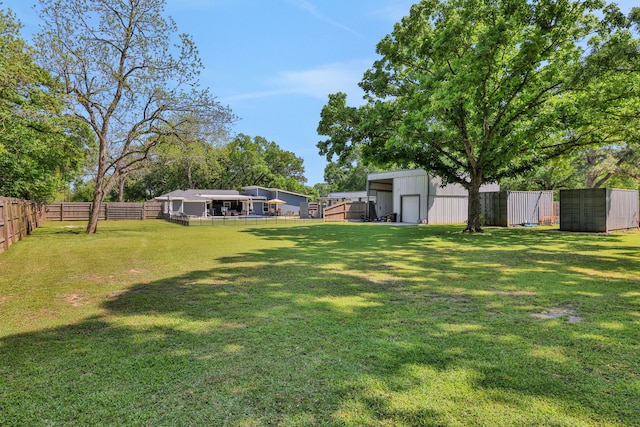 1315 Kilgore Rd, Baytown, TX 77520 - view of yard with an outdoor structure and a fenced backyard