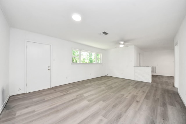 206 Hill St, Dayton, TX 77535 - interior space with visible vents, light wood-type flooring, and a ceiling fan