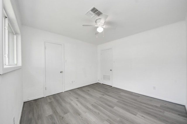 206 Hill St, Dayton, TX 77535 - unfurnished bedroom with baseboards, visible vents, a ceiling fan, and light wood-style flooring