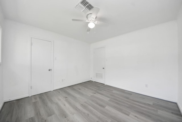 206 Hill St, Dayton, TX 77535 - unfurnished room featuring baseboards, visible vents, wood finished floors, and ceiling fan